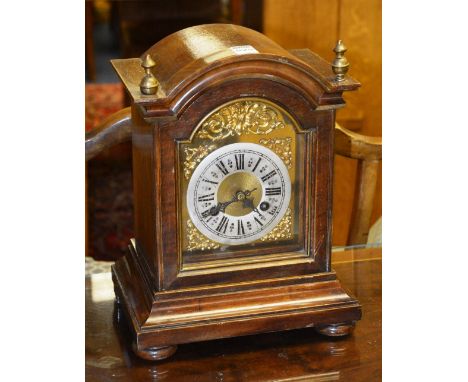 A George III style mahogany bracket clock, with silvered dial surrounded by gilt spandrels, 33cm high