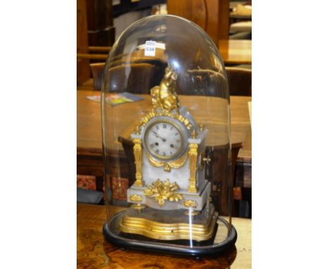 A Victorian French Alabaster mantle clock, decorated with gilded cherub finial to top, above gilded floral mounts, raised on 