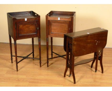 A pair of early 20th century mahogany pot cupboards, with ring tops above hinged door, raised on turned supports and cross st