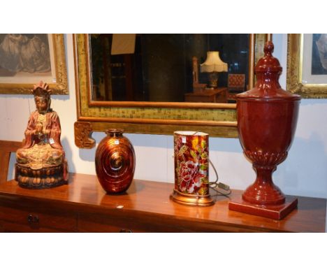 A modern painted figure of a seated Chinese figure, approx 60cm high, together with a modern table lamp, vase and red glazed 