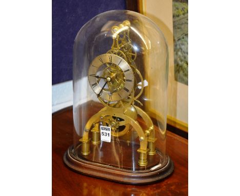 A Victorian brass skeleton clock, with single fusee brass drum movement, black Roman numerals to the chapter ring, raised on 