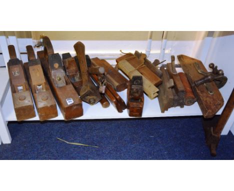 A quantity of woodworking planes and tools