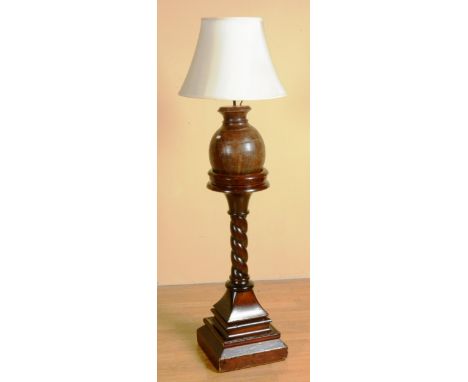 A stained wood church pedestal, 89cm high, together with a wooden table lamp with shade (2)