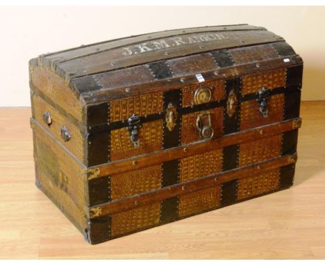 A vintage wood and metal bound travel trunk, with domed hinged lid painted within JKM Rankin, 54cm high x 91cm wide