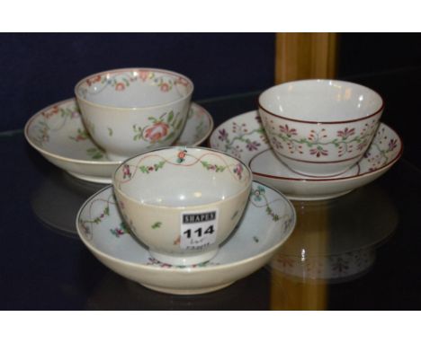 Three late 19th century porcelain tea bowls, with matching saucers, decorated with enamel floral garlands, 7cm high