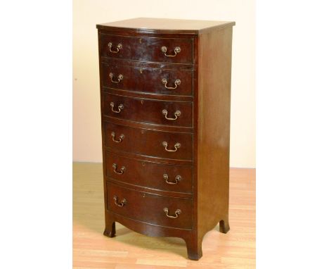 A Wylie & Lochhead mahogany chest of drawers, with six graduated drawers, raised on bracket supports, 120cm high x 61cm wide 