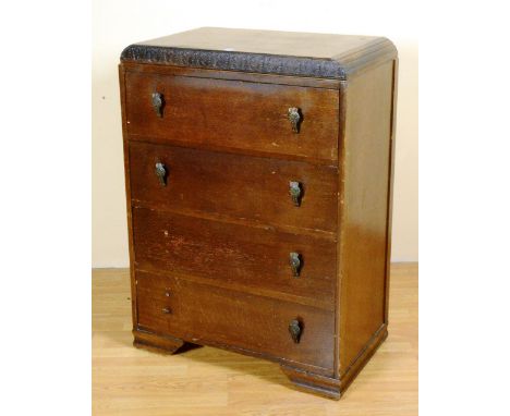 A 1940's oak chest of drawers, with four graduated drawers, raised on bracket supports, 105cm high x 76cm wide