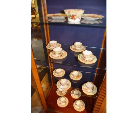 A Nautilus porcelain tea set, comprising two biscuit plates, sugar bowl, six side plates, 11 saucers and 11 cups, decorated w