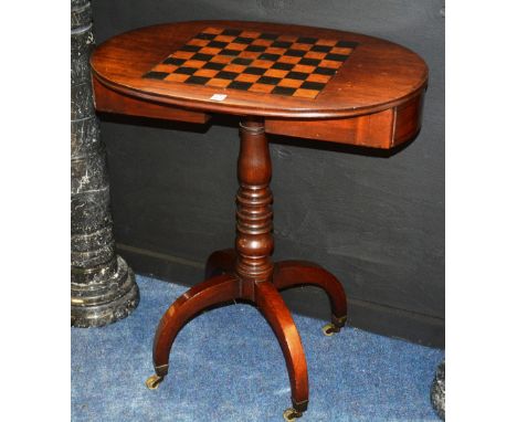 A Victorian mahogany inlaid D-end games table, with pull out drawer enclosing chess and draught pieces, raised on faceted col