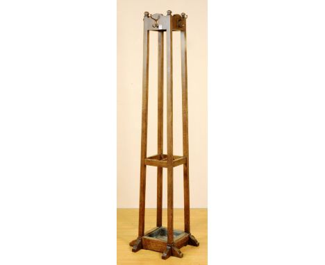 An oak hat and coat stand, with fitted hooks above a stick stand recess and dust pan, 186cm high CONDITION REPORT: Lot 324 - 