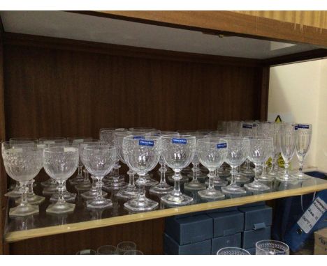 An extensive collection on three shelves of Villeroy &amp; Boch 'Miss Desiree' laurel leaf pattern glassware including fourte