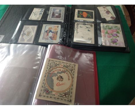 A box containing more than 150 old traditional greetings cards, album and a bag of photographs with a possible story to tell 