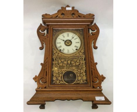 A late 19th century American clock by the Seth Thomas Clock Company, Connecticut, the enamel dial with Roman numerals denotin