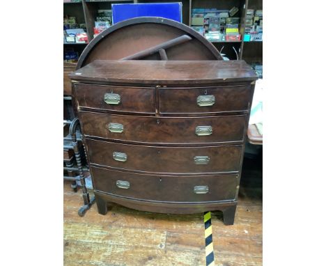 A George III mahogany veneered bow-front chest of drawers, with brass handles, on shaped bracket feet, 106cm wide (af) 