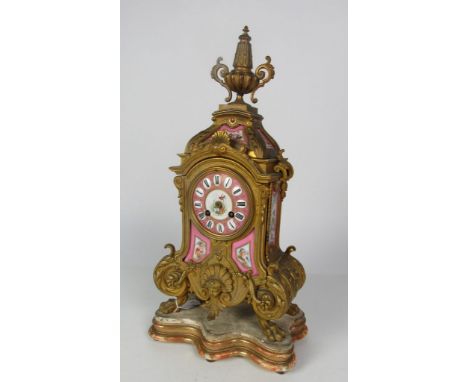 A good quality 19th Century ormolu Mantle Clock, with pink ground porcelain panels painted with cherubs, flowers etc., and wi