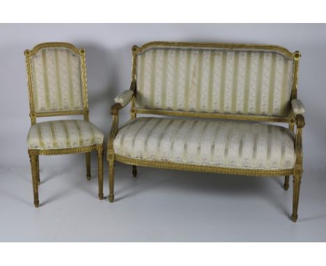 A French Regency period three piece carved giltwood Parlour Suite, comprising two matching Side Chairs and two seater Settee,