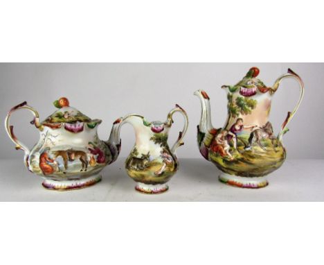 An attractive hand painted and embossed three piece Tea and Coffee Set, Naples c. 1900, decorated with classical rural scenes