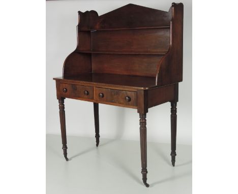 An unusual early 19th Century mahogany Bookcase / Side Table, with shelf back, over a rectangular top with two frieze drawers