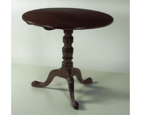 A good late Georgian circular flip top oak Occasional Table, on turned pillar support and tripod base. (1)