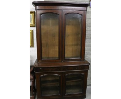 A good quality early Victorian figured mahogany Bookcase, of attractive size, the moulded cornice over two glazed panel doors