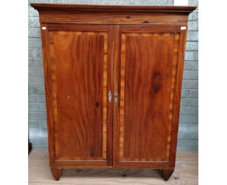 A 19th Century two door Wardrobe, the cornice with Greek key moulding, over two crossbanded panel doors, 132cms (52") wide; 1