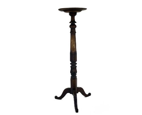 A large early Victorian carved mahogany Torchere or Plant Stand, with dished top,on tripod base, 152.5cms (60") high. (1)