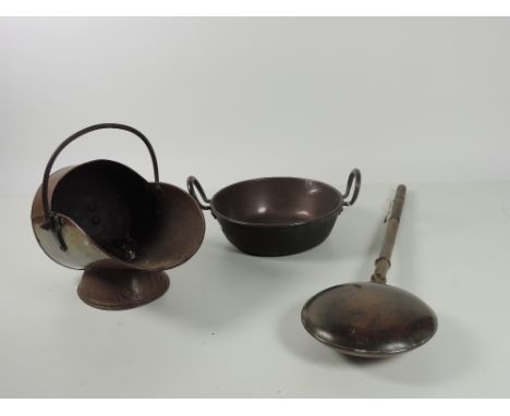 An antique copper Preserving Pan, a copper Bed Warmer with long turned handle, and heavy antique copper helmet shaped Coal Sc