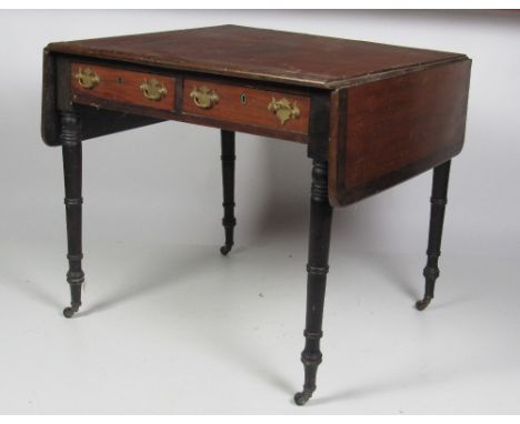 An early 19th Century mahogany Sofa Table, with crossbanded top, two small frieze drawers, brass handles, on turned feet, wor