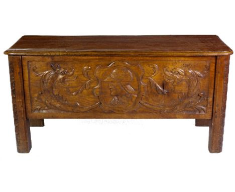 A late 18th / early 19th Century oak carved Coffer, possibly Spanish, the lift top with original hinges, with a front frieze 