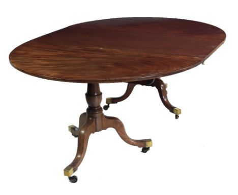 An early 19th Century mahogany two pod Dining Table, and extra leaf, with demi-lune ends on tripod base with brass castors, a