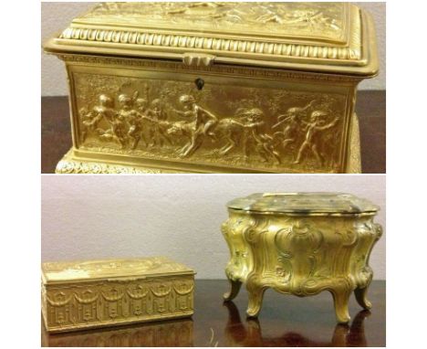 A fine quality and attractive rectangular gilded Casket, with various embossed scenes on lid and four sides, and with upholst