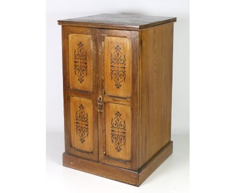 A 19th Century Sacristy Cupboard, with decorative panel doors opening to reveal a single drawer with brass handles and shelve