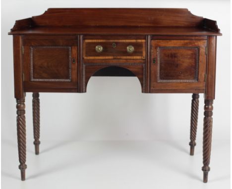 A 19th Century mahogany Sideboard of small proportions, the shaped gallery back over a crossbanded frieze drawer, arched cent