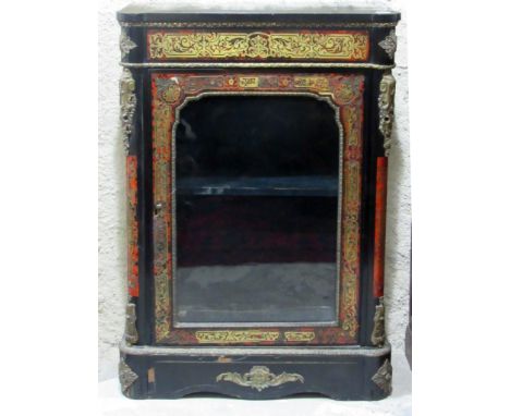 A 19th Century French red boulle Side Cabinet, the shaped rectangular top above a brass inlaid frieze and single glazed panel