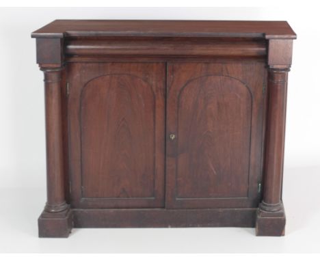 A 19th Century rosewood Cabinet, with inverted top with frieze drawer over two panel doors flanked by pillar supports on plin