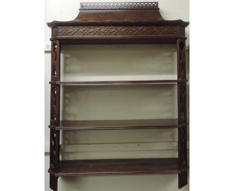 An attractive Chinese Chippendale style mahogany three shelf Wall Bracket, with pagoda style top and fretwork sides, 112cms x