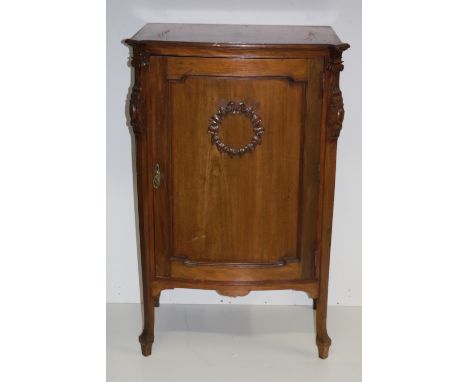 A large Edwardian mahogany Music Cabinet, the single panel door and sides with carved decoration. (1)The dimensions of same i