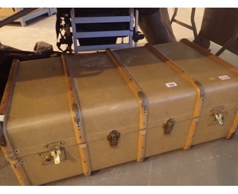 Large brown storage trunk with wood strapping and leather handles