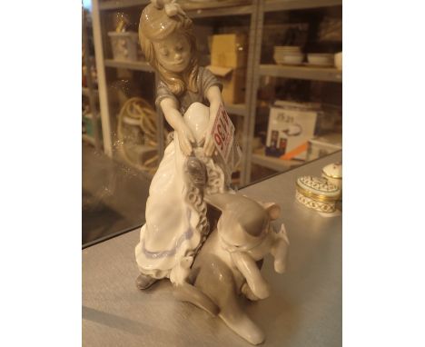 Lladro cat figurine and a Nao girl figurine