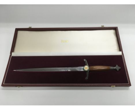 A cased presentation dagger by Wilkinson Sword.