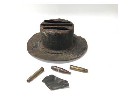 A world war head lamp cover for motor vehicles to reduce light emissions, a pair of shell cases and some small bullet casings