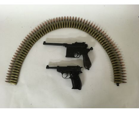 A pair of Denix Replica German sidearms to include a Mauser C96 replica marked BKA 221 and a Walther P38 Replica, alongside a