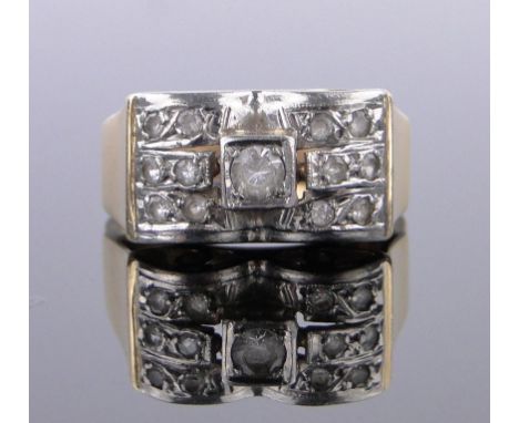 An unmarked gold diamond set cluster ring.