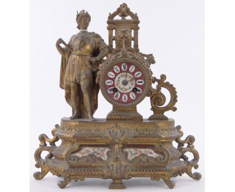 A continental gilded spelter mantel clock surmounted by a figure,height 14".
