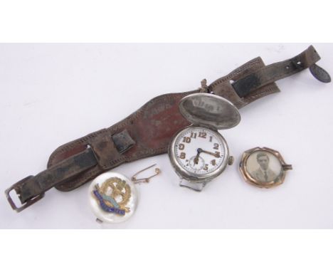 A First World War period watch,Middlesex Regiment brooch and pendant with photograph of the owner, Edward Beck.