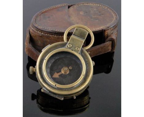 A First War period brass military compass,dated 1917 in original leather case stamped Hobson & Sons, London.