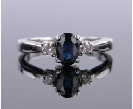 A 9ct white gold 3 stone sapphire and diamond ring,size K.