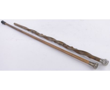Two Vintage walking canes with hallmarked silver knops.