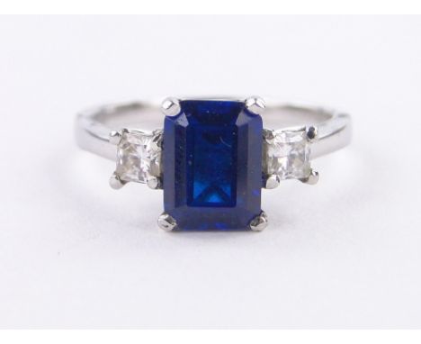 A platinum 3 stone square-cut sapphire and diamond ring,sapphire 8mm x 6mm, size M.