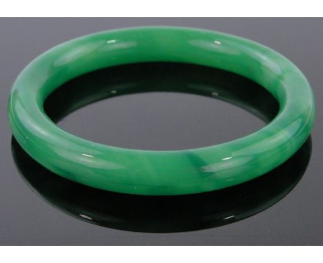 A green jade bangle, 3".